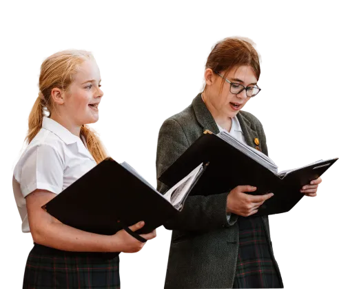 two wrekin senior students singing from musical scores